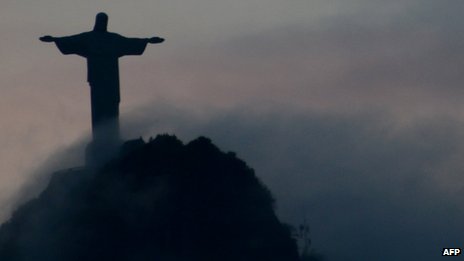 Christ the Redeemer statue overlooking Rio de Janeiro at sunset on 24 April 2012
