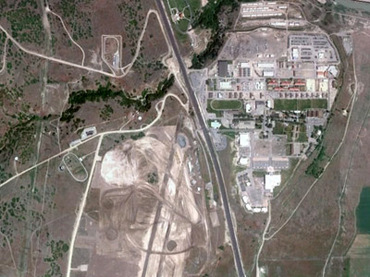 Overview of Camp Williams site before the construction works began. UDC will be located on the west side of the highway, on what was previously an airfield (Image from www.publicintelligence.net)